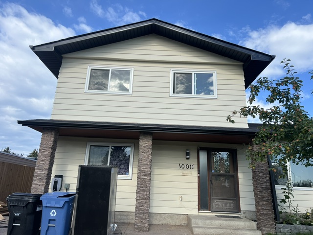 Cream siding house before exterior painting